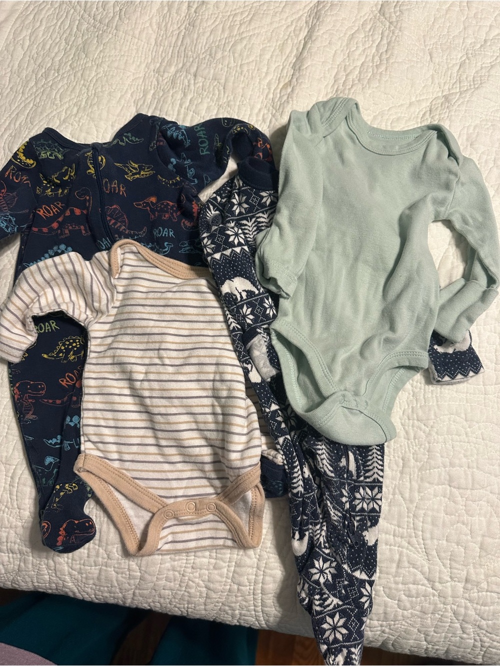 0287 4 piece set of footed PJs and onesies size 0-3 and newborn